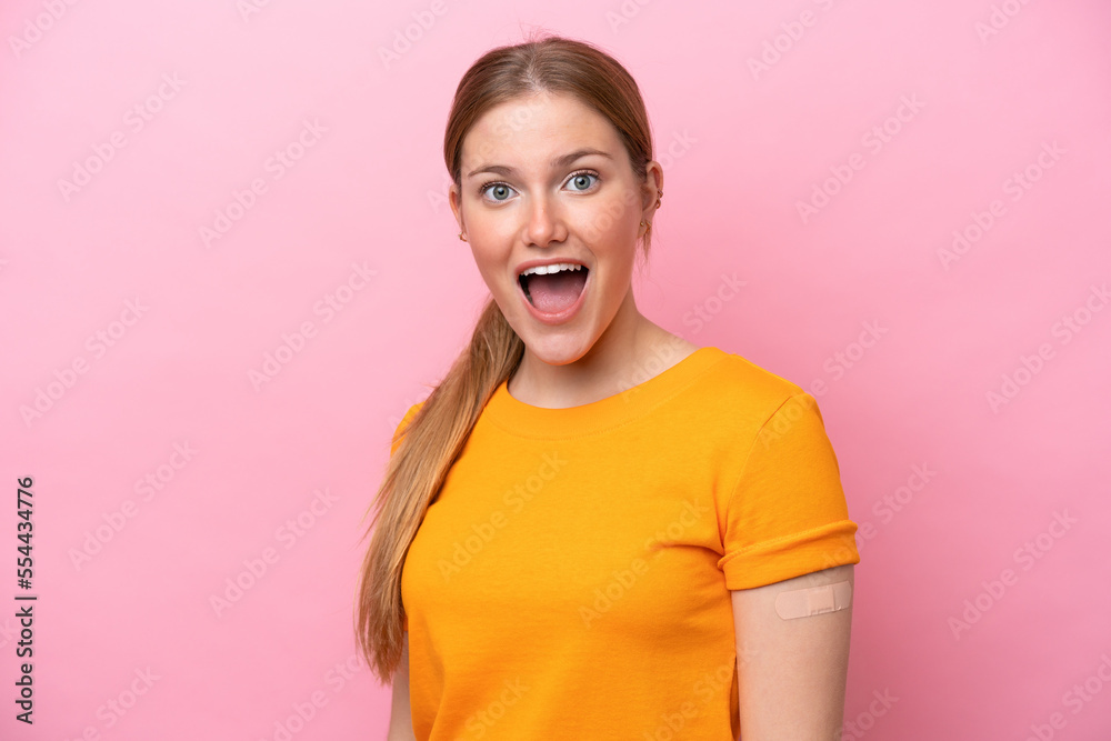 Young caucasian woman wearing band aid isolated on pink background with surprise and shocked facial expression Young caucasian woman wearing band aid isolated on pink background with surprise and shocked facial expression