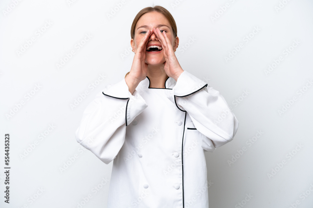 Young chef woman isolated on white background shouting and announcing something Young chef woman isolated on white background shouting and announcing something