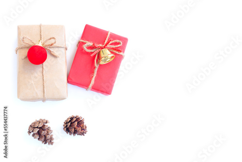 Christmas and New year decorations, Gift boxs, Pine cones, Golden bell and Red decoration christmas ball on white background