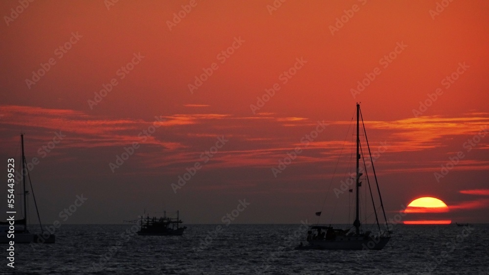 sunset sea sand sun sky boat