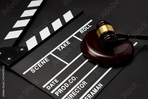 Clapper board and judge gavel background photo