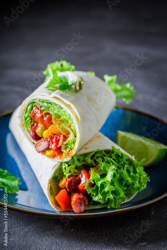 Tasty and spicy burrito wit...