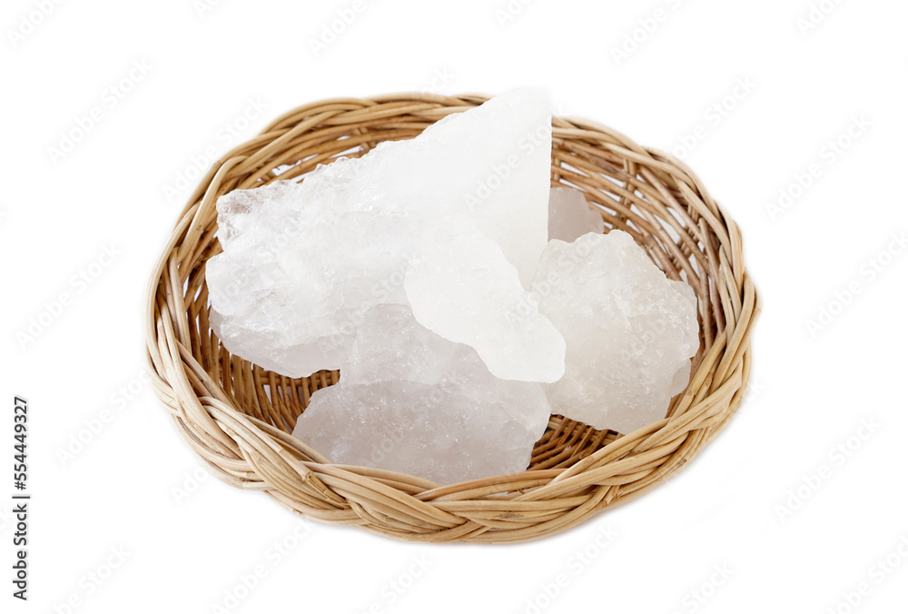 Crystal clear alum stones or Potassium alum on basket isolated on white background. Useful for beauty and spa treatment. Use to treat body odor under the armpits as deodorant and make water clear. Crystal clear alum stones or Potassium alum on basket isolated on white background. Useful for beauty and spa treatment. Use to treat body odor under the armpits as deodorant and make water clear.