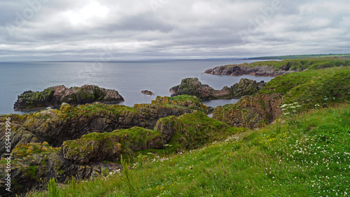 rocky coastline, about one kilometer east of Cruden Bay photo