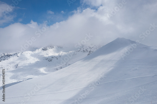 nature and man skier descends from the mountain. © fotomaster