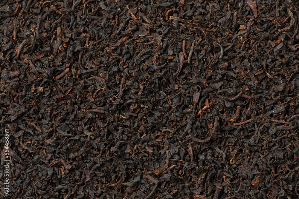 Uva Highlands dried tea leaves full frame close up as background Uva Highlands dried tea leaves full frame close up as background