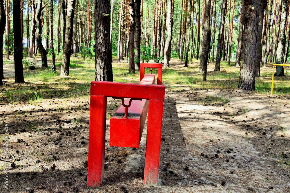 Element of the obstacle course in the forest. Steel beam on supports