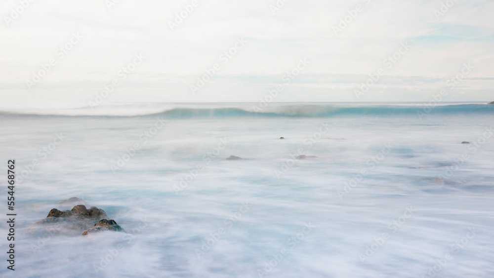 Copy space of a seascape with a veil of water with copy space for your advertising text message or promotional content. Perfect landscape background for web page with copy space. Postcard.