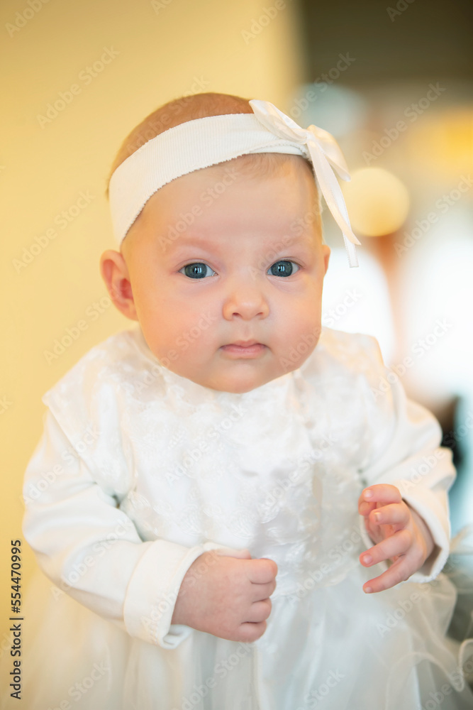 Portrait of a little three-month-old girl in white clothes. Portrait of a little three-month-old girl in white clothes.
