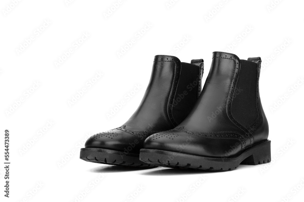Black women's leather shoes on a white background. Fashion trend. Winter season half-boots.