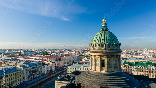 Aerial front, up view of the enter dome and colonnade of the Kazan Cathedral in the historical city of St. Petersburg at sunny summer dawn