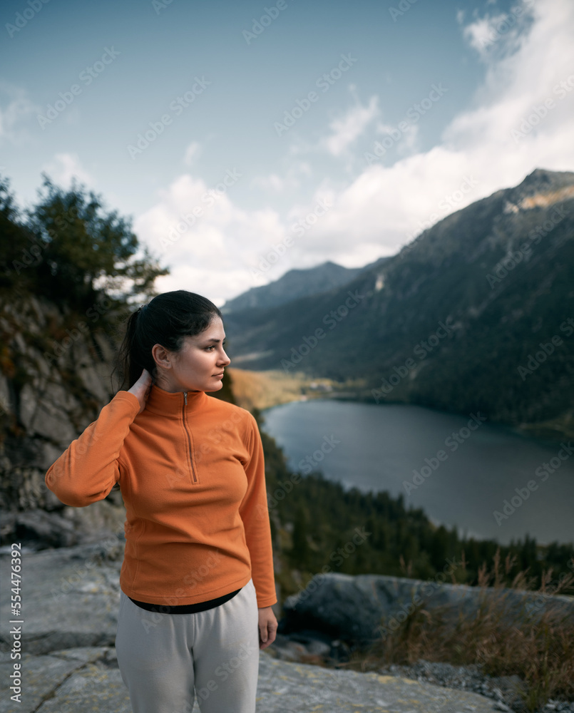 Sporty brunette woman on the mountain national park.