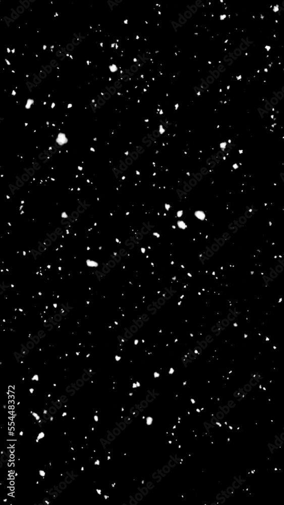 Snow flakes overlay slowly falling - snowy winter night effect vertical shot on black background. Storm layer High quality 4k footage Snow flakes overlay slowly falling - snowy winter night effect vertical shot on black background. Storm layer High quality 4k footage