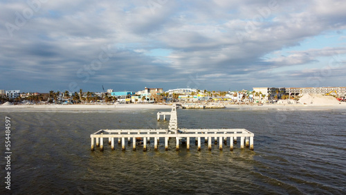 Fototapeta Naklejka Na Ścianę i Meble -  A month after Hurricane Ian brought historic winds and storm surge to the island of Fort Myers Beach, rubble still sits in piles near the shore. 