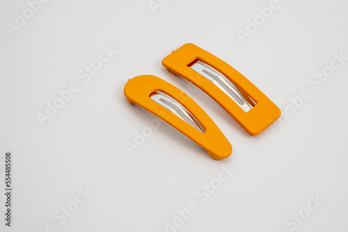 set of two yellow hair grips slides styles isolated on a white background