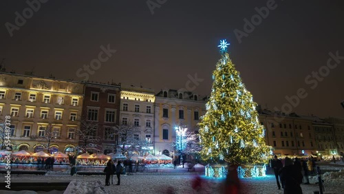 Wallpaper Mural Christmas lights timelapse. Christmas tree and holiday illumination timelapse. New Year eve. Night timelapse of crowed street in christmas holidays.  Krakow Main Market Square with Christmas Tree.  Torontodigital.ca