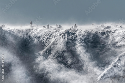 Beautiful winter panorama, Karkonosze mountains with people, severe landscape of Giant Mountains