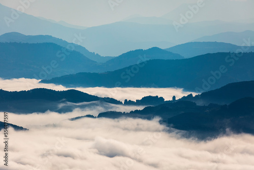 blue mountains and sea of fog after sunrise