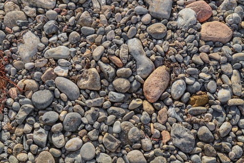 Wet gravel on the side of the road