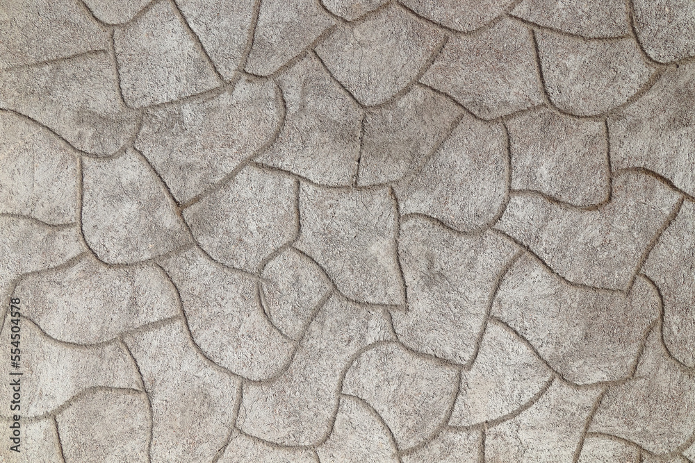 Rough cement plaster imitating stones on the wall close-up. High resolution photo. Rough cement plaster imitating stones on the wall close-up. High resolution photo.