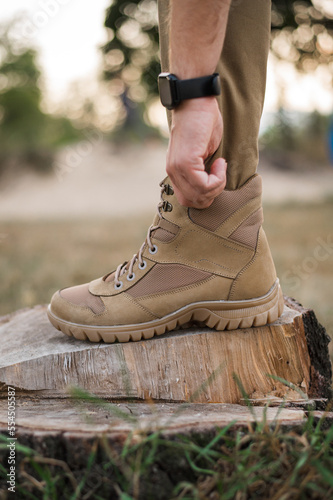 A soldier shod in special tactical khaki shoes