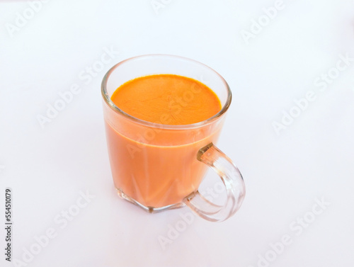 Cup of a milk tea creamy milktea caj (chai) or chaay milk shaicup a famous beverage of South Asia India Pakistan closeup image stock photo photo