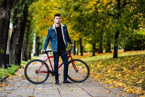 Young man biking in city 
