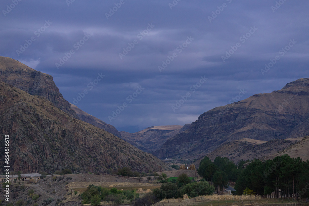 Naklejka premium mountain and river view, dramatic sky