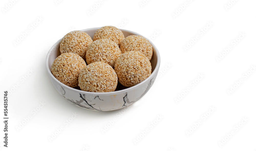 Indian sweet for traditional festival makar sankranti Rajgira laddu made from Amaranth seed in Bowl on white background Indian sweet for traditional festival makar sankranti Rajgira laddu made from Amaranth seed in Bowl on white background