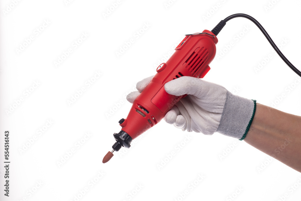 Multi-grinding machine. Drilling rotary tool, Dremel tool heads. On a white isolated background. Multi tool. For working with wood, metal and stone. Multi-grinding machine. Drilling rotary tool, Dremel tool heads. On a white isolated background. Multi tool. For working with wood, metal and stone.