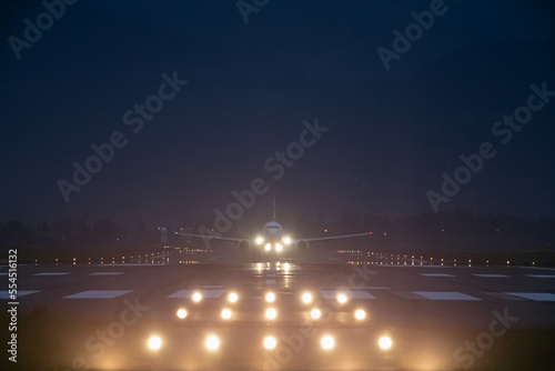 Slika na platnu passenger plane takes off at night, airfield lights