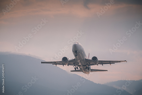 passenger plane takes off front view against