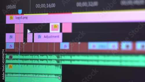 Video editing on computer close up. Computer screen and capture work of program for video editing. Fragments clips are connected together. Video processing, cutting movie, postproduction, clip maker