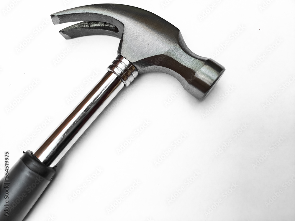 Hammer isolated on white background. Hammer and nail puller, two in one. Close up of a Hammer with a rubberized handle. Hammer isolated on white background. Hammer and nail puller, two in one. Close up of a Hammer with a rubberized handle.