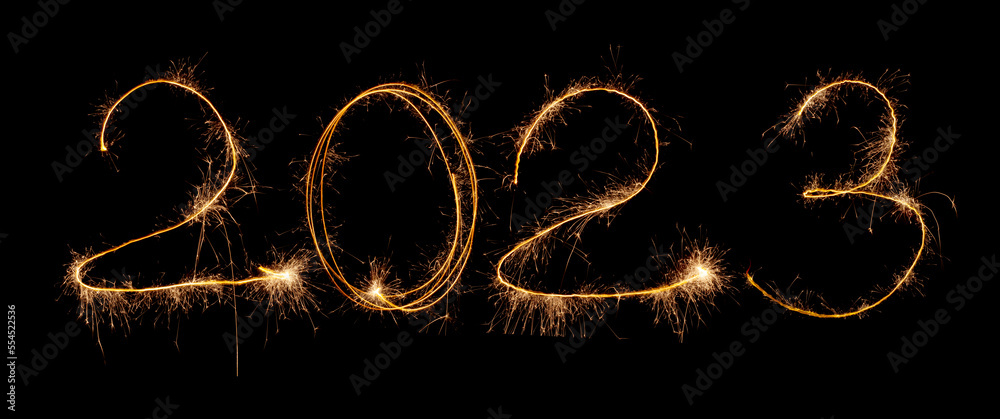 2023 inscription of numbers from sparklers and sparks on a black background. Isolated sparks of New Year's fireworks in the dark. 2023 inscription of numbers from sparklers and sparks on a black background. Isolated sparks of New Year's fireworks in the dark.