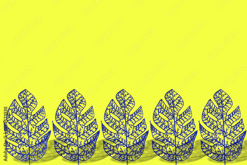 leaf decorations at the bottom of the yellow background, copy space above, creative art design
leaf decorations at the bottom of the yellow background, copy space above, creative art design