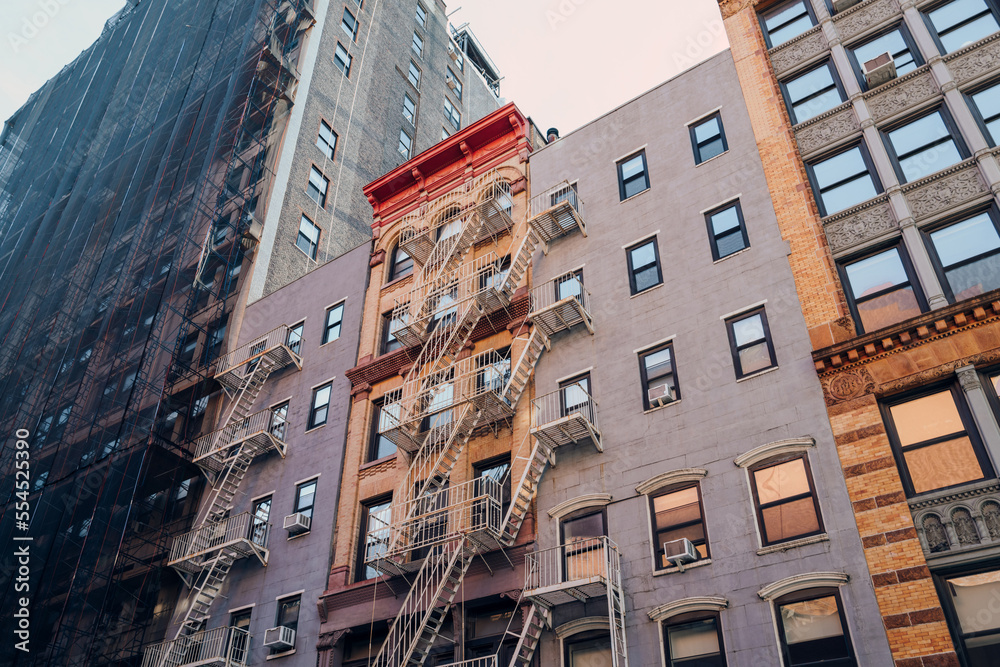 Typical New York apartment blocks with fire escape at the front in NoHo,  New York City, USA. Stock-Foto | Adobe Stock