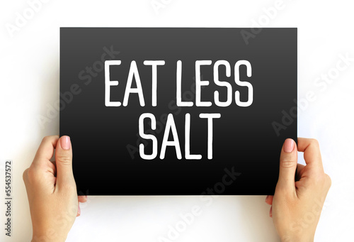 Eat Less Salt text quote on card, health concept background