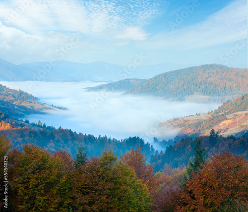 Autumn misty morning mountain valley