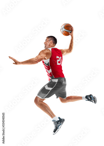 Basketball player in a jump. Basketball player in motion and action. Sport energy. Sport emotion. Isolated © Ruslan Shevchenko