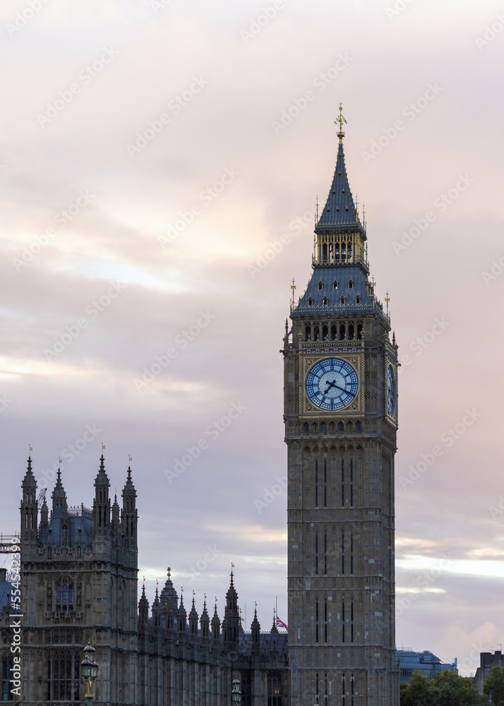Fototapeta premium Palace of Westminster with its distinctive Tower of Big Ben at sunset and beautiful coloured sky, handheld shot.