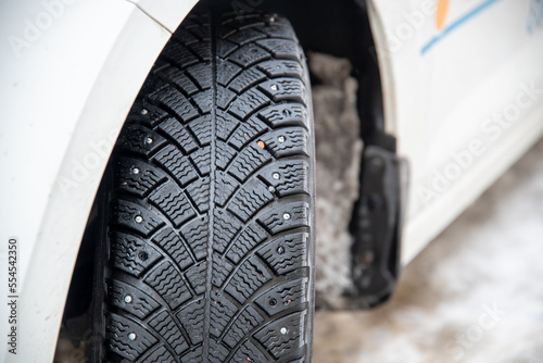Close up of winter tyres during bad snowy weather © Joose