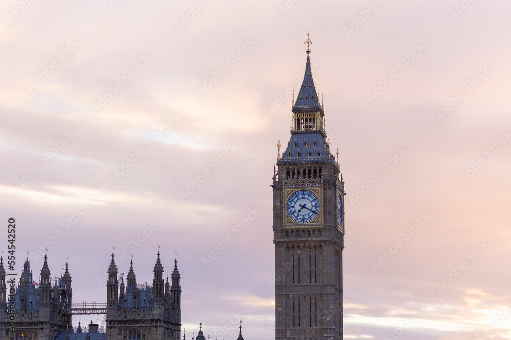 Palace of Westminster with its distinctive Tower of Big Ben at sunset and beautiful coloured sky, handheld shot.