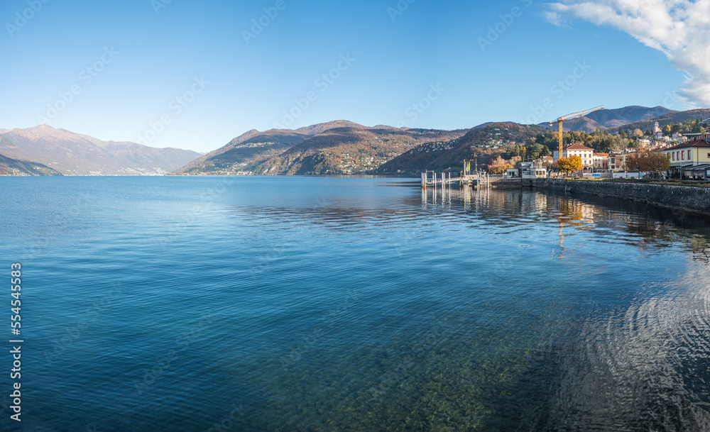 Extra wide angle view of The promenade on the lake in Luino with the mountains in the background