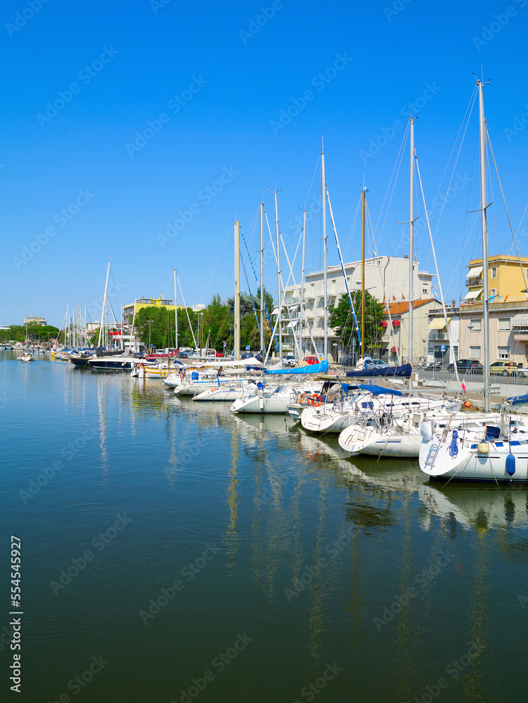 View of Rimini sea port with yachts and blue water.