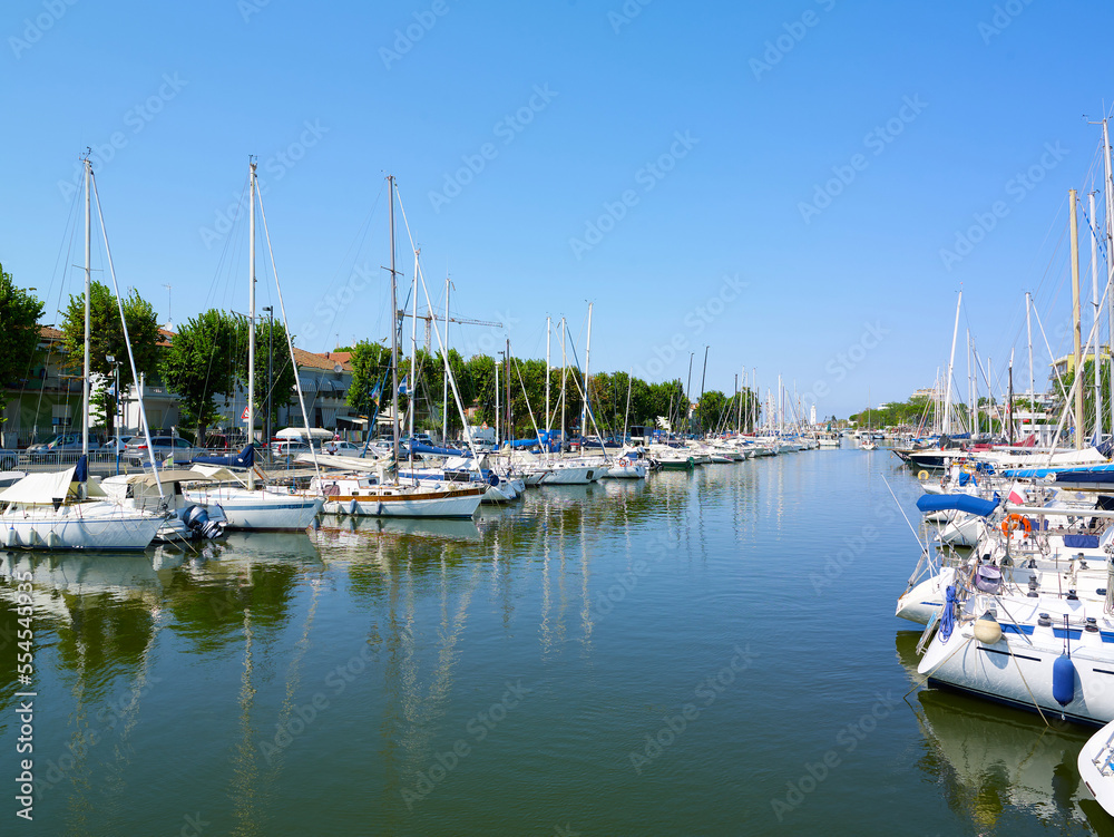 View of Rimini sea port with yachts and blue water.