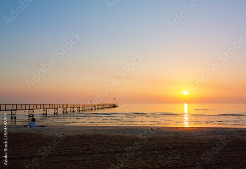 Amazing Sunset on the Sea. Adriatic sea, pier, sunset, waves and landscape. Rimini, Italy.
