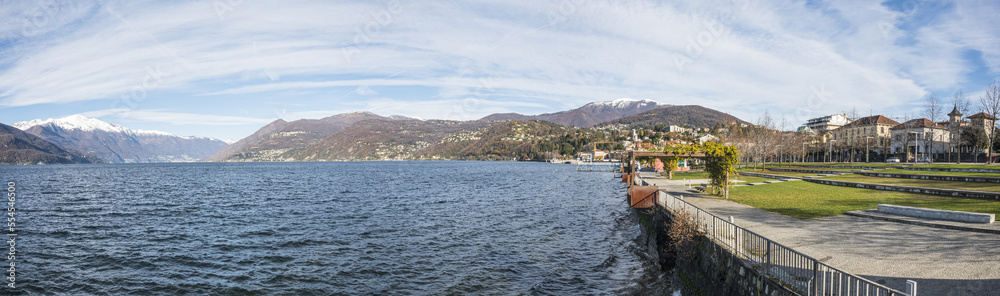 The beautiful Parco a Lago in Luino with the snow-capped mountains in the background