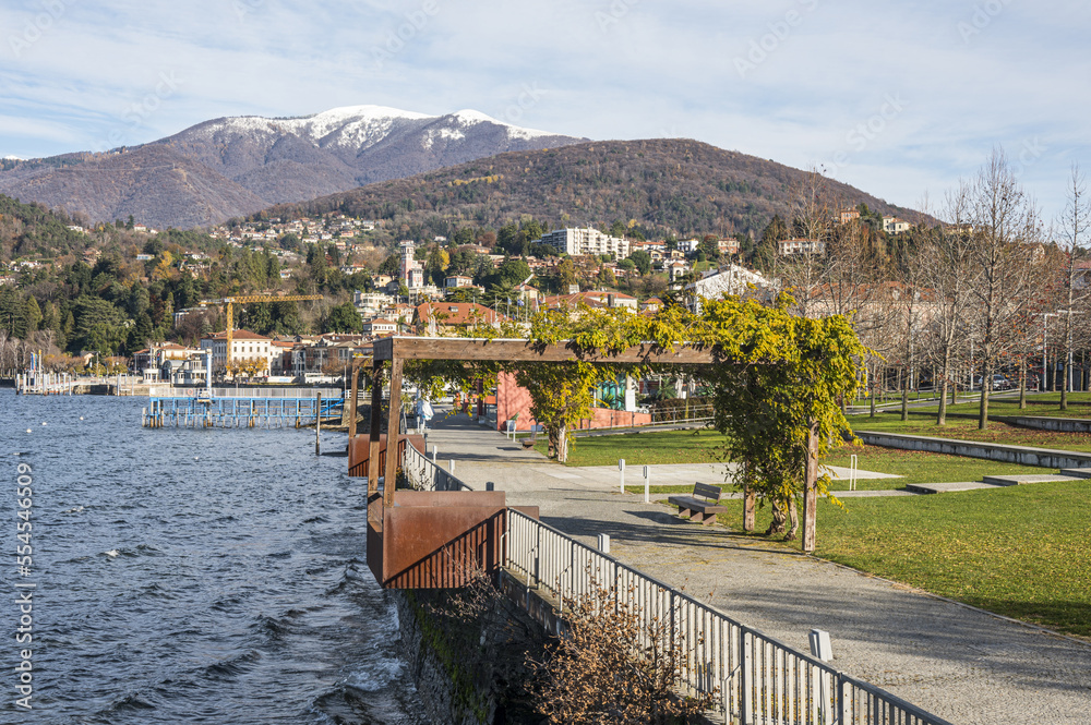The beautiful Parco a Lago in Luino with the snow-capped mountains in the background