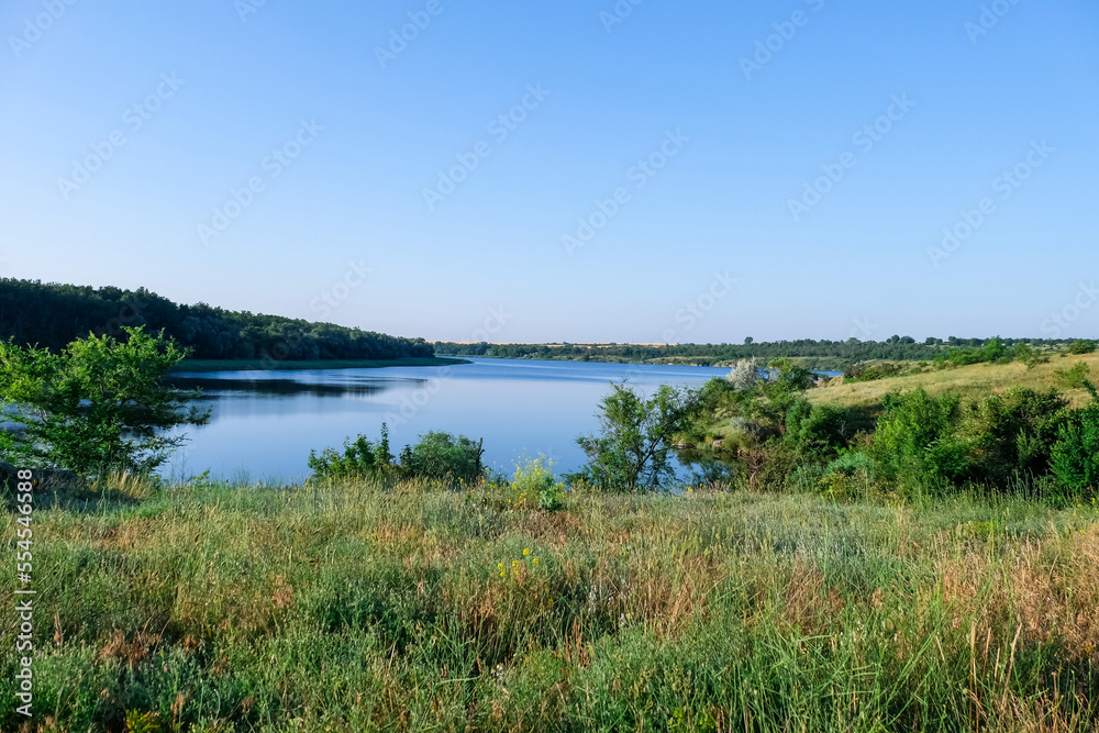 Beautiful view of lawn and river Beautiful view of lawn and river